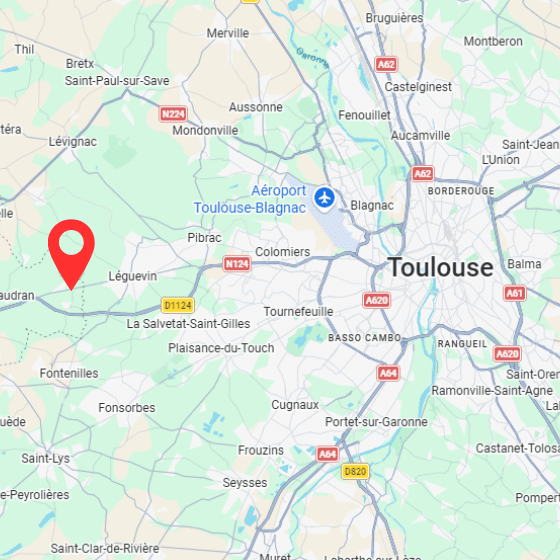 Une carte montrant la région autour de Toulouse, France, avec les routes et les villes proches indiquées. Une punaise rouge est placée à l'ouest de Toulouse près de Léguevin, et l'aéroport de Toulouse-Blagnac est indiqué par une icône d'avion.
